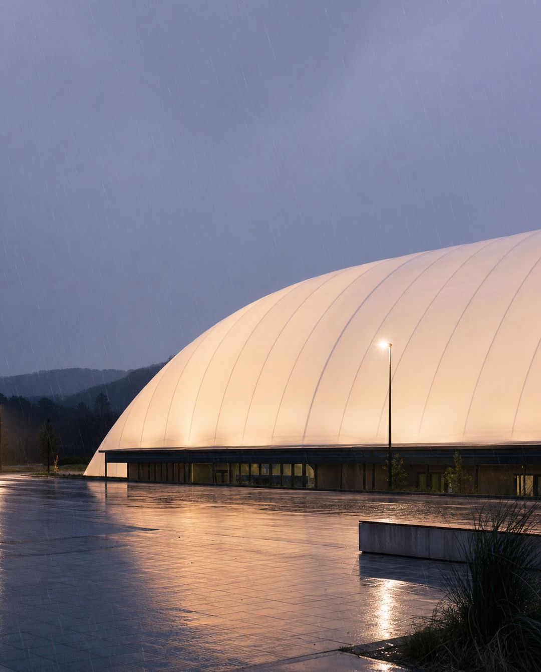 Concept visualisation — proposed Air Dome glowing at wet dusk in the rain